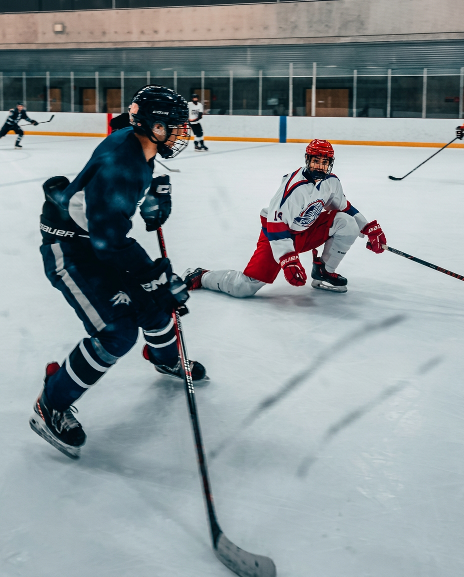 Hockey puck and stick on freshly cut ice